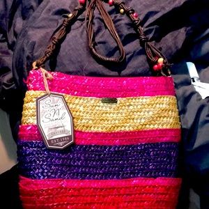 A beautiful bright long strap colorful handbag